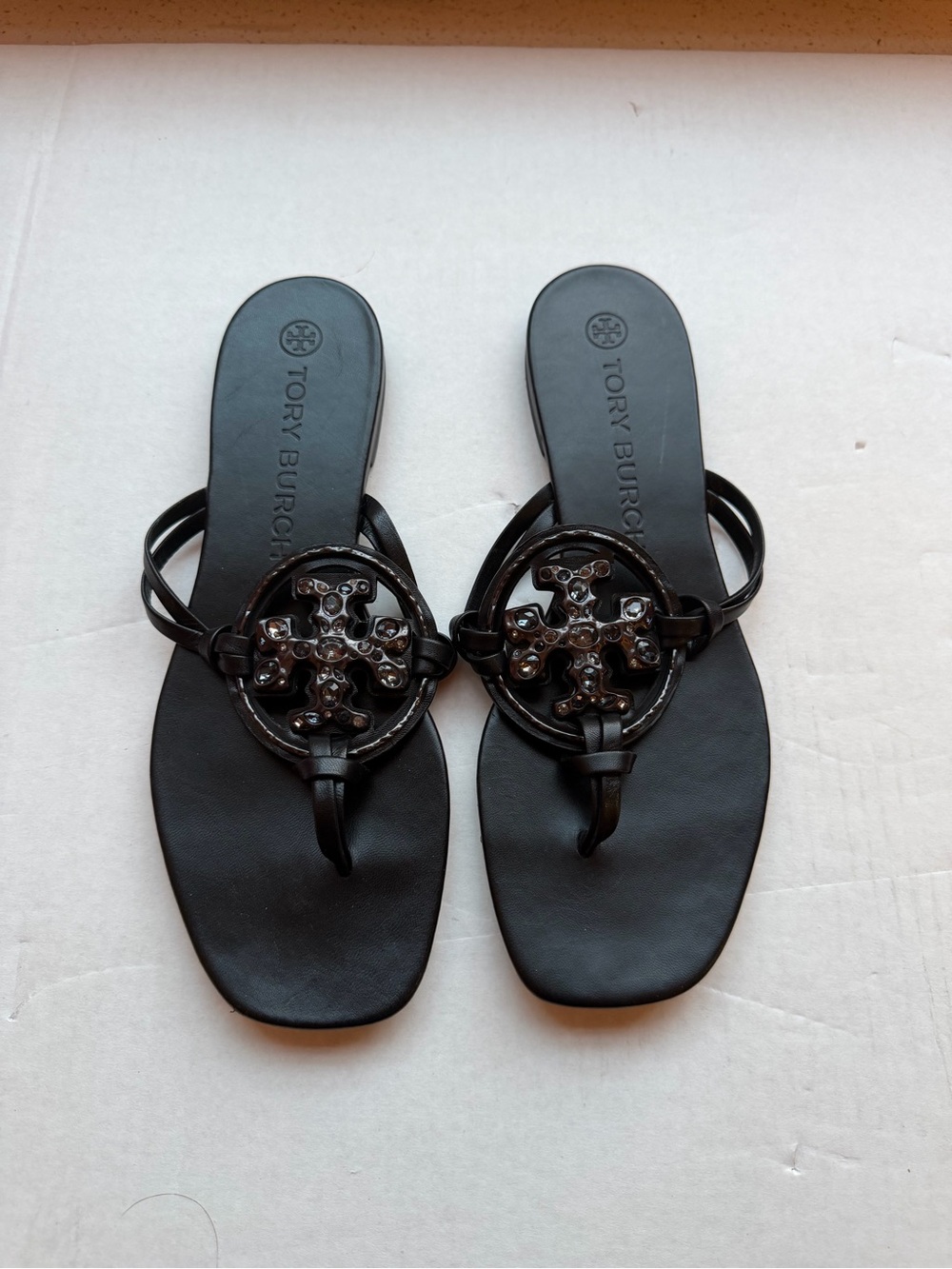 Tory Burch Black Patent Logo Thong Sandals with Embellished Medallion